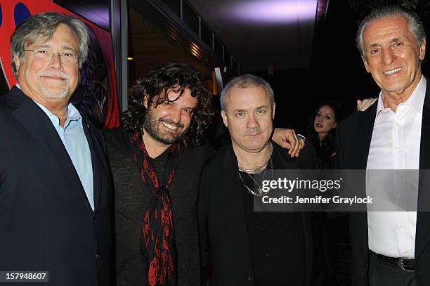 Miami Heat Managing General Partner Micky Arison, artist Domingo Zapata, artist Damien Hirst and Miami Heat President Pat Riley attend the Haute...