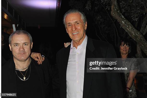 Artist Damien Hirst and Miami Heat President Pat Riley attend the Haute Living Hublot And Ferrari Honor Domingo Zapata For Art Basel 2012 on December...