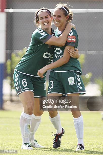 Nicole Sykes is congratulated by Caitlin Munoz of Canberra United after scoring a goal during the round eight W-League match between Canberra United...