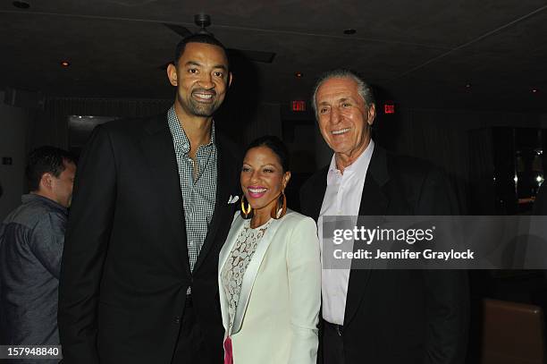 Miami Heat player Juwan Howard, wife Jenine Wardally, and Miami Heat President Pat Riley attend the Haute Living Hublot And Ferrari Honor Domingo...