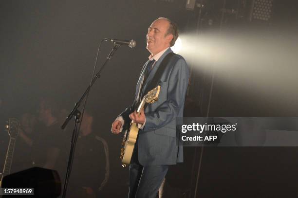 British singer and guitarist Mick Jones , founder of the band "The Clash" performs during the 34th Trans Musicales Music Festival on December 7, 2012...