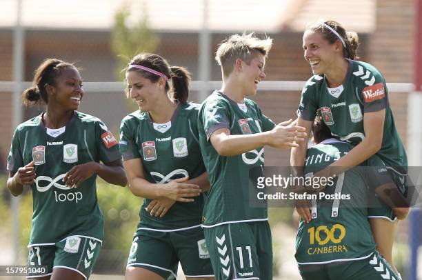 Nicole Sykes of Canberra United is congratulated by team mates after scoring a goal during the round eight W-League match between Canberra United and...