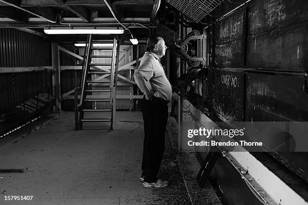 Scoreboard operator watches play during an international tour match between the Chairman's XI and Sri Lanka from inside The Jack Fingleton Scoreboard...