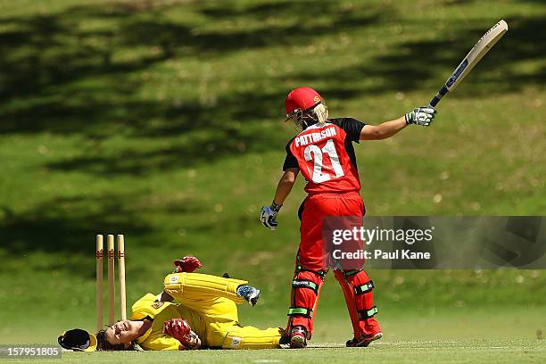 Bridget Patterson of the Scorpions reacts after being run out by Jenny Wallace of the Fury during the WNCL match between the Western Australia Fury...