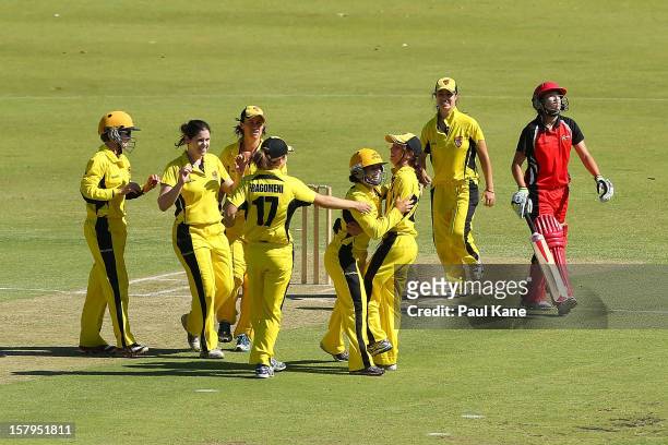 Fury players celebrate after dismissing Megan Schutt of the Scorpions and winning the WNCL match between the Western Australia Fury and the South...