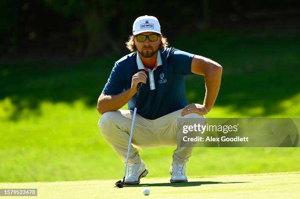 Roger Sloan of Canada sets up the tenth hole during the third round of the Utah Championship presented by Zions Bank at Oakridge Country Club on...