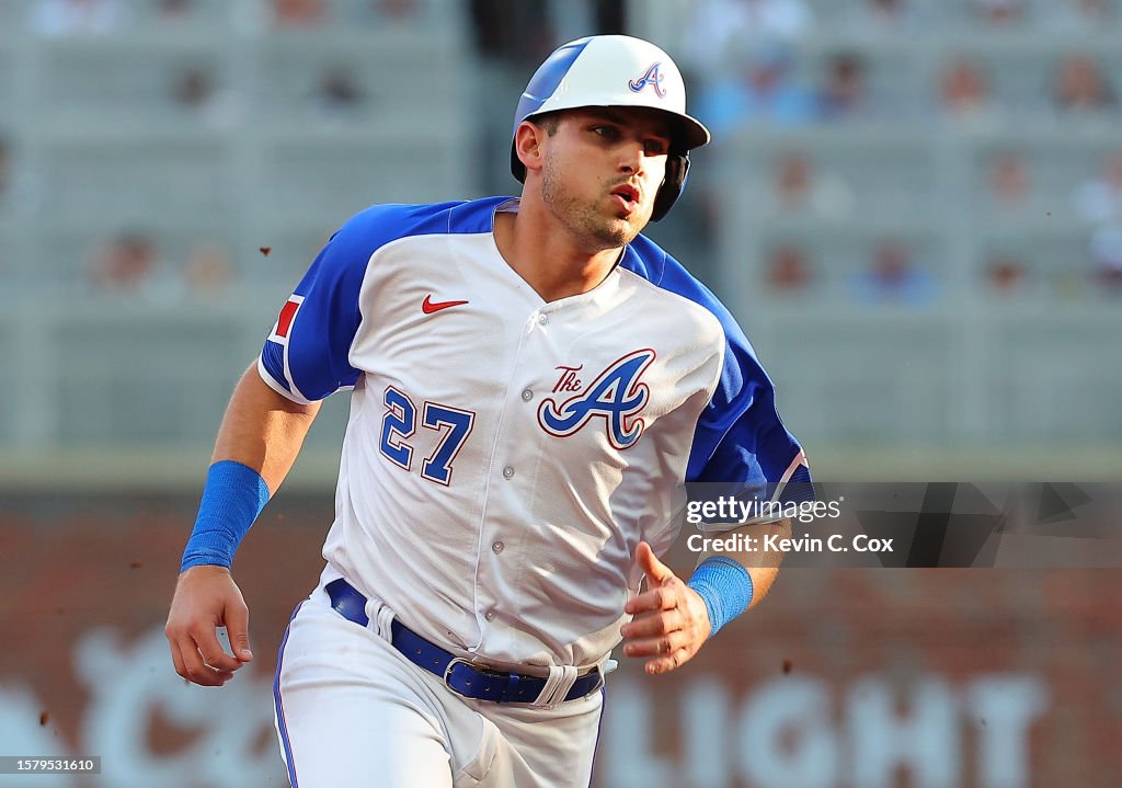 Austin Riley Third Base Austin Riley of the Atlanta Braves runs to third base on a RBI single ...