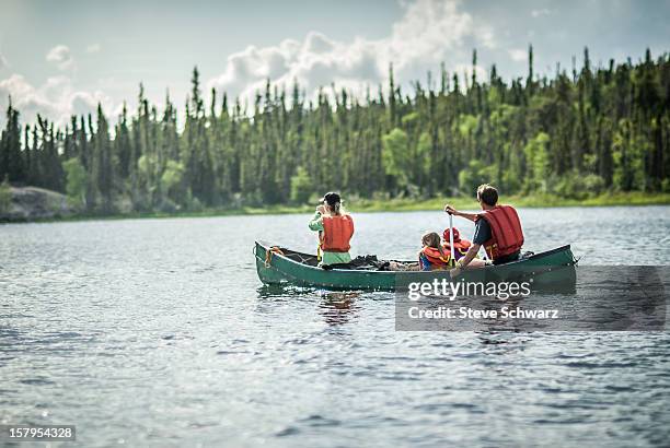 family on a afternoon canoe trip. - yellowknife canada stockfoto's en -beelden