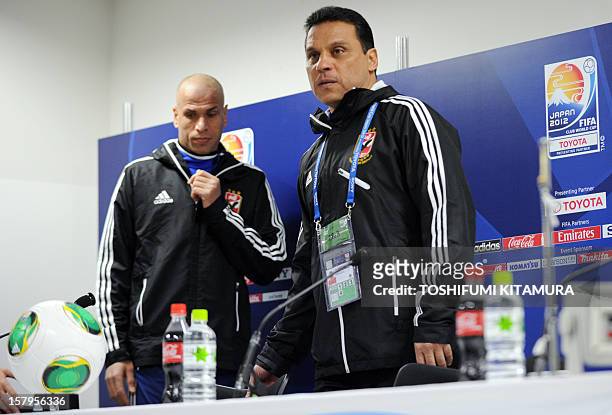 Egyptian football club team Al Ahly head coach Hossam El-Badry and defender Wael Gomaa enter for a press conference prior to an official team...