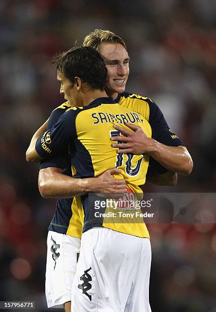 Trent Sainsbury and Zachary Anderson of the Mariners embrace after beating the Jets during the round ten A-League match between the Newcastle Jets...