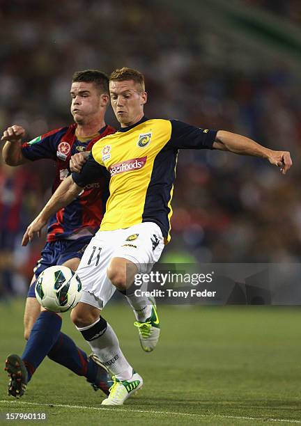 Oliver Bolzanic of the Mariners contests the ball with his Jets opponent during the round ten A-League match between the Newcastle Jets and the...