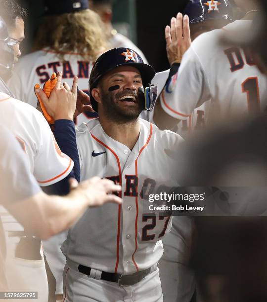 Jose Altuve of the Houston Astros hits a home run in the seventh inning against the Tampa Bay Rays at Minute Maid Park on July 29, 2023 in Houston,...