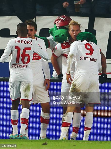 Vedad Ibisevic of Stuttgart celebrates his team's third goal with team mates during the Bundesliga match between VfB Stuttgart and FC Schalke 04 at...