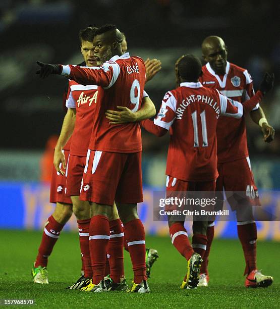 Djibril Cisse of Queens Park Rangers celebrates scoring his team's second goal with his team-mates during the Barclays Premier League match between...