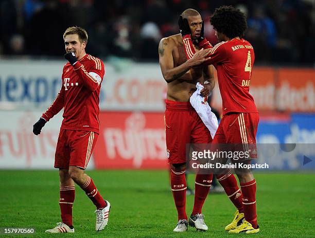 Philipp Lahm of Muenchen , reacts next to team mates Jerome Boateng and Dante after the Bundesliga match between FC Augsburg and FC Bayern Muenchen...