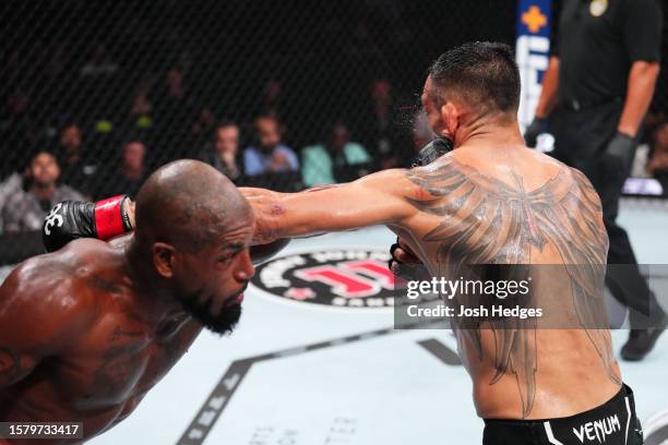 Bobby Green punches Tony Ferguson in a lightweight fight during the UFC 291 event at Delta Center on July 29, 2023 in Salt Lake City, Utah.