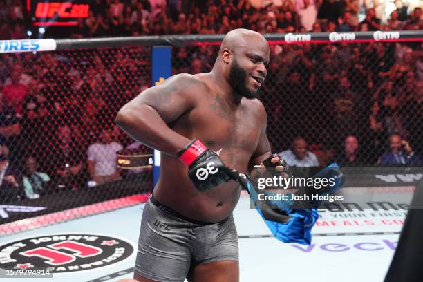 Derrick Lewis celebrates his TKO victory over Marcos Rogerio de Lima of Brazil in a heavyweight fight during the UFC 291 event at Delta Center on...