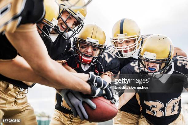 american football teamwork. - touchdown stock pictures, royalty-free photos & images