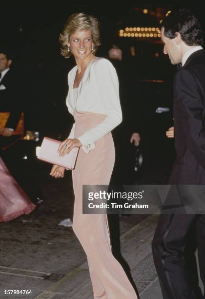 Diana, Princess Of Wales at the London Coliseum for a performance of the ballet 'Swan Lake' by the Bolshoi Ballet, 27th July 1989. Her dress is by...
