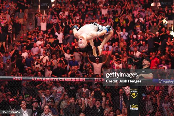 Justin Gaethje celebrates his KO victory over Dustin Poirier in a lightweight fight for the BMF belt during the UFC 291 event at Delta Center on July...