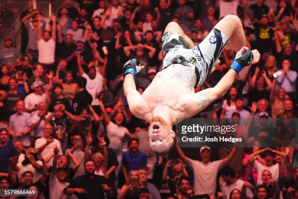 Justin Gaethje celebrates his KO victory over Dustin Poirier in a lightweight fight for the BMF belt during the UFC 291 event at Delta Center on July...