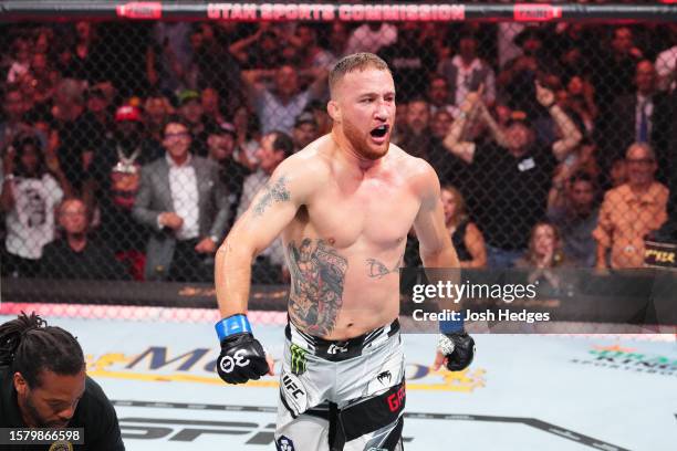 Justin Gaethje celebrates his KO victory over Dustin Poirier in a lightweight fight for the BMF belt during the UFC 291 event at Delta Center on July...