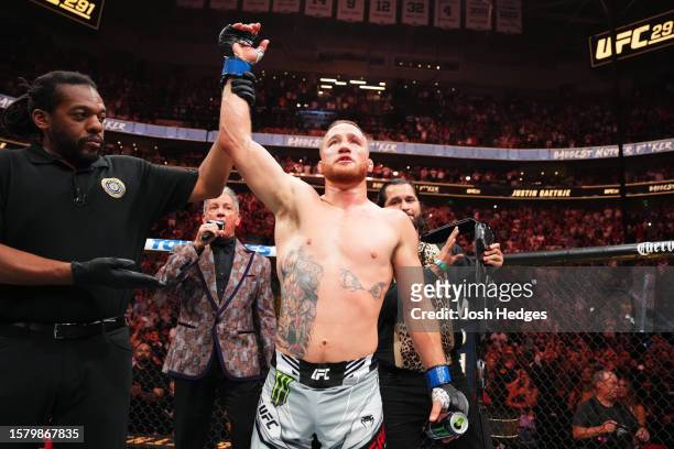 Justin Gaethje celebrates his KO victory over Dustin Poirier in a lightweight fight for the BMF belt during the UFC 291 event at Delta Center on July...