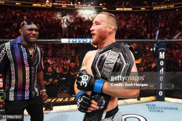 Justin Gaethje celebrates with Kamaru Usman after his KO victory over Dustin Poirier in a lightweight fight for the BMF belt during the UFC 291 event...