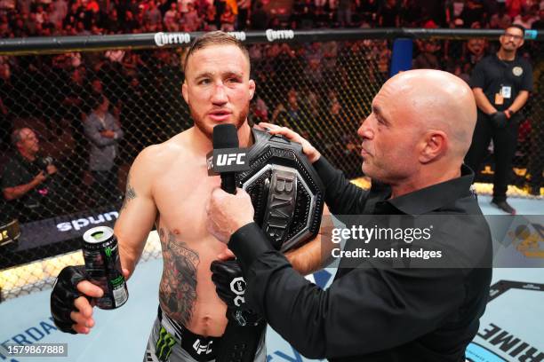 Justin Gaethje is interviewed by Joe Rogan after his victory over Dustin Poirier in a lightweight fight for the BMF belt during the UFC 291 event at...