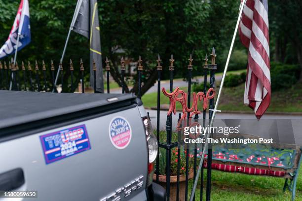 Trump flags, stickers, and decorations are seen outside Jerry Ramsey's home on Thursday, August 3, 2023 in Marietta, GA.