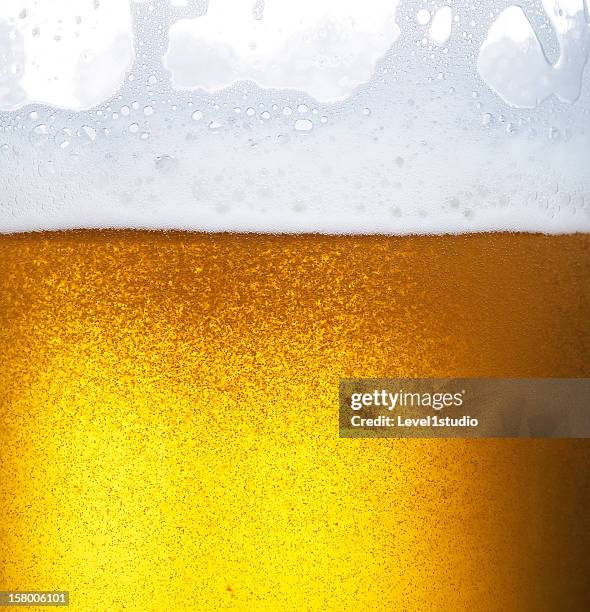 froth on beer - beer close up stock pictures, royalty-free photos & images
