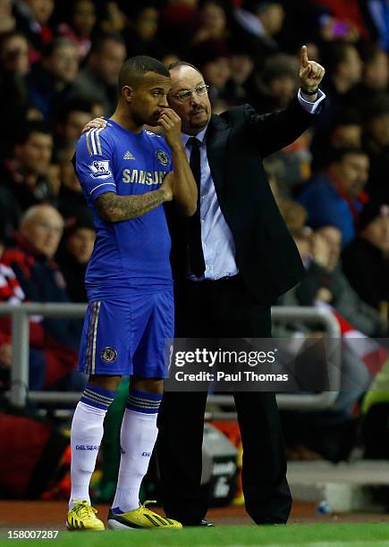 Manager Rafa Benitez of Chelsea speaks to his player Ryan Bertrand before he goes on during the Barclays Premier League match between Sunderland and...