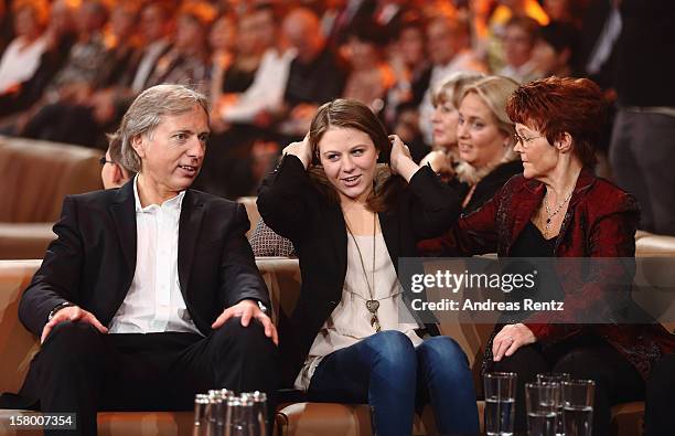 Uli Ferber with daughter Lena Maria and Helga Zellen gesture during the Andrea Berg 'Die 20 Jahre Show' at Baden Arena on December 7, 2012 in...