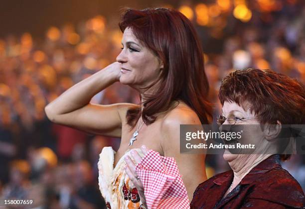 Andrea Berg and her mother Helga Zellen gesture during the Andrea Berg 'Die 20 Jahre Show' at Baden Arena on December 7, 2012 in Offenburg, Germany.