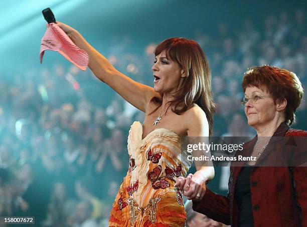 Andrea Berg and her mother Helga Zellen gesture during the Andrea Berg 'Die 20 Jahre Show' at Baden Arena on December 7, 2012 in Offenburg, Germany.