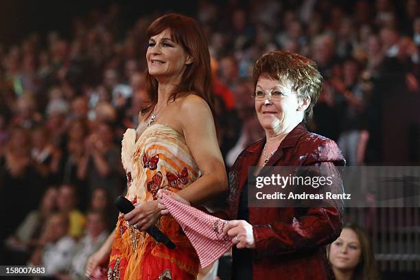 Andrea Berg and her mother Helga Zellen gesture during the Andrea Berg 'Die 20 Jahre Show' at Baden Arena on December 7, 2012 in Offenburg, Germany.