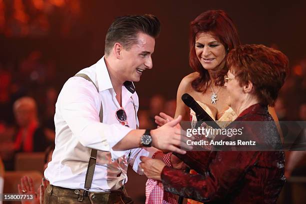 Andreas Gabalier, Andrea Berg and her mother Helga Zellen gesture during the Andrea Berg 'Die 20 Jahre Show' at Baden Arena on December 7, 2012 in...