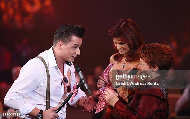 Andreas Gabalier, Andrea Berg and her mother Helga Zellen gesture during the Andrea Berg 'Die 20 Jahre Show' at Baden Arena on December 7, 2012 in...