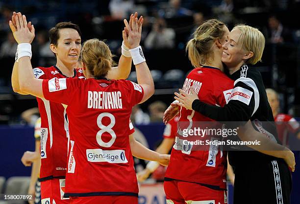 Kristine Lunde-Borgersen and Karoline Dyhre Breivang and Marit Malm Frafjord and Katrine Lunde Haraldsen of Norway celebrate victory against Ukraine...