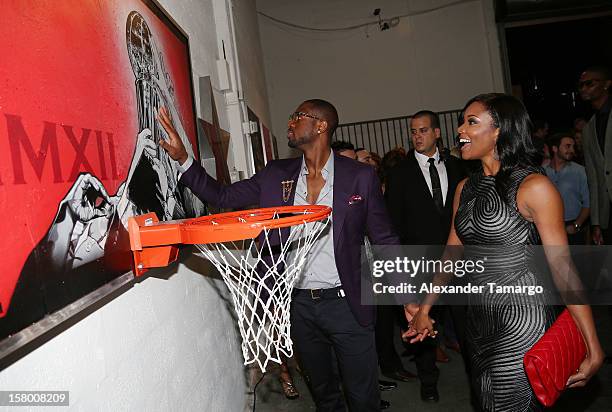 Dwyane Wade and Gabrielle Union make an appearance as Premier Beverage Hosts Art Of Basketball: Heat Wave With Dwyane Wade & Chris Bosh on December...