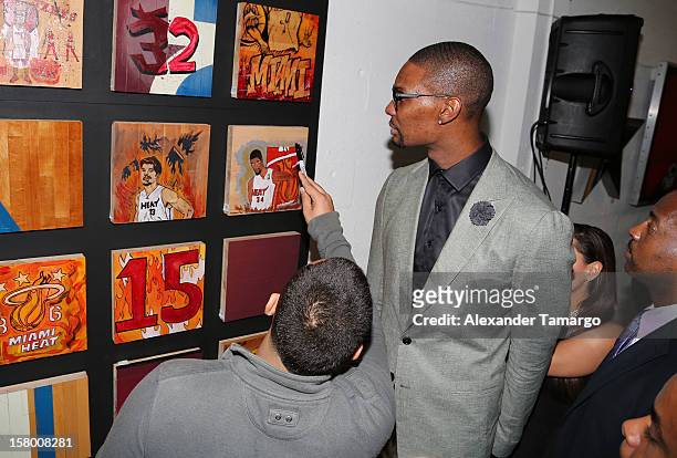 Chris Bosh makes an appearance as Premier Beverage Hosts Art Of Basketball: Heat Wave With Dwyane Wade & Chris Bosh on December 7, 2012 in Miami,...
