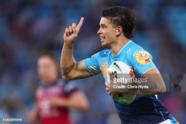 Jayden Campbell of the Titans celebrates a try during the round 22 NRL match between Gold Coast Titans and North Queensland Cowboys at Cbus Super...