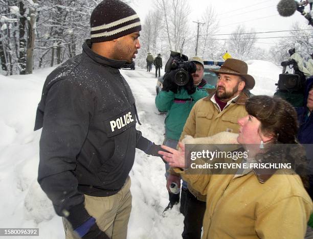 Federal agent tries to block Linda and Larry Faillace from entering their farm in the early morning as the USDA begins inventorying the family's farm...