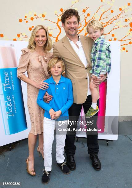 Actors Anne Heche and James Tupper attend the launch of her "Tickle Time Sunblock" at The COOP on December 8, 2012 in Studio City, California.