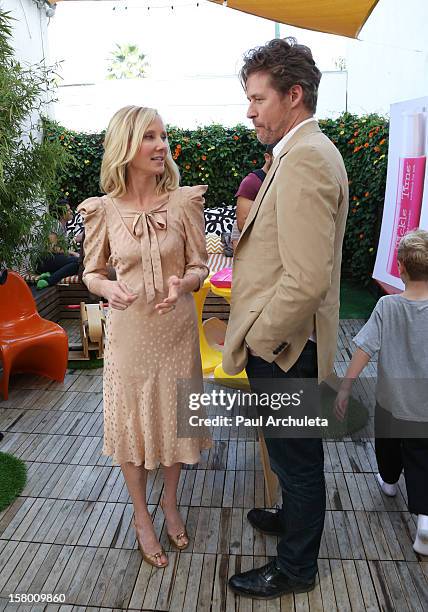 Actors Anne Heche and James Tupper attend the launch of her "Tickle Time Sunblock" at The COOP on December 8, 2012 in Studio City, California.