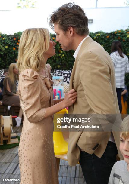 Actors Anne Heche and James Tupper attend the launch of her "Tickle Time Sunblock" at The COOP on December 8, 2012 in Studio City, California.