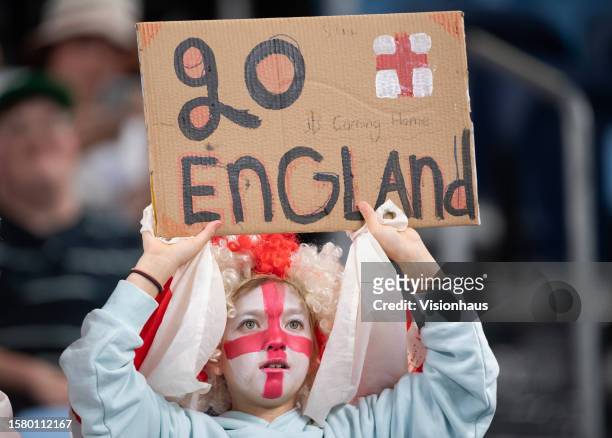 Young, face painted fan holds up a sign reading GO ENGLAND during the FIFA Women's World Cup Australia & New Zealand 2023 Group D match between...