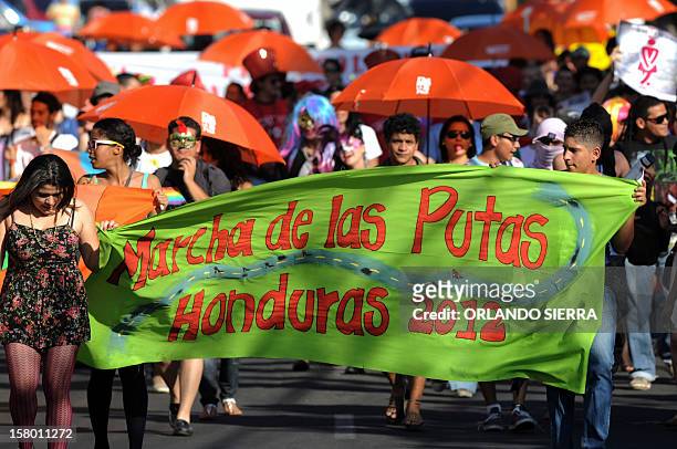 People march during the Marcha de las Putas on December 8, 2012 in Tegucigalpa, to protest against violence against women and demand more respect and...