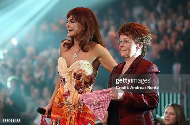 Andrea Berg and her mother Helga Zellen smile during the Andrea Berg 'Die 20 Jahre Show' at Baden Arena on December 7, 2012 in Offenburg, Germany.