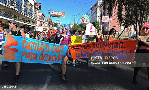 People march during the Marcha de las Putas on December 8, 2012 in Tegucigalpa, to protest against violence against women and demand more respect and...